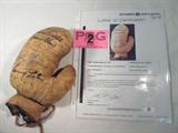 Autographed Boxing Glove 7 Great Boxers ACE
An amazing left handed leather boxing glove that has been signed by 7 of the most famous names in the sport. Signatures include Jack Dempsey, Joe Louis, Muhammad Ali / Cassius Clay, Joe Frazier, Rocky Marciano and Sonny Liston. Signatures are certified by Autograph Certification Experts, LLC, Justin Chris Priddy, President. Certification # B40411, can be verified at www.autographcertificationexperts.com.
From the internet:
"Muhammad Ali (born Cassius Marcellus Clay, Jr.; January 17, 1942) is an American former professional boxer, philanthropist and social activist. Considered a cultural icon, Ali was both idolized and vilified. Originally known as Cassius Clay, Ali changed his name after joining the Nation of Islam in 1964, subsequently converting to Sunni Islam in 1975, and more recently practicing Sufism. In 1967, three years after Ali had won the World Heavyweight Championship, he was publicly vilified for his refusal to be conscripted int