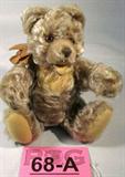 Vintage Steiff Mohair Teddy Bear w/ Glass Eyes
Darling dark blonde teddy bear with poseable arms and legs and brown glass eyes. Appears to be Steiff Mohair teddy bear but he does not have a tag or button. Measures approximately 8".
