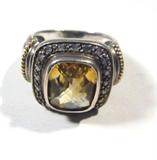 Jewelry Sterling Silver 14kt Gold Ring
Beautiful sterling silver ring with 14kt yellow gold accents. Featuring large faceted yellow colored stone, possibly a Citrine, surrounded by small diamond stones. Ring size: 7.5, total weight: .30 ozt.
#2447-9021-CFSG53459