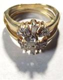 Jewelry 14kt Yellow Gold Diamond Wedding Ring
Gorgeous 14kt yellow gold diamond ring featuring round brilliant cut and baguette cut diamond stones. Single stone ring sets inside band accented with several diamond stones. One small baguette diamond is missing. Ring size: 6, marked "14k". Total weight: 3.3 dwt.