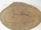 Jim Thorpe Autographed Suede Football AAU
A vintage suede, single stitched, mini football which has been hand signed by Jim Thorpe. Signature is certified by Authentic Autographs Unlimited, Serial #F10461. The Certificate of Authenticity is signed by Drew V. Max, a Court Qualified and Board Certified Forensic Document Examiner and handwriting expert who specializes in celebrities, sports, and antiquities. You may have seen Mr. Max on the reality television show "Pawn Stars".
From the internet: "James Francis "Jim" Thorpe (Sac and Fox (Sauk): Wa-Tho-Huk, translated to "Bright Path")(May 28, 1888 – March 28, 1953) was an American athlete of mixed ancestry (Caucasian and Native American). Considered one of the most versatile athletes of modern sports, he won Olympic gold medals for the 1912 pentathlon and decathlon, played American football (collegiate and professional), and also played professional baseball and basketball. He lost his Olympic titles after it was found he was paid for pla