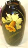 Weller Pottery Vase w/ Daffodil Design
A beautiful hand painted vase featuring a single blooming daffodil. Bottom of vase is marked "Weller". Measures 9" tall with a 4" diameter.