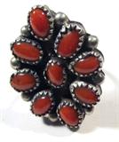Jewelry Sterling Silver Coral Ring
Fabulous sterling silver ring featuring several pieces of polished red coral in sawtooth setting. Unmarked, consignor states this piece is sterling. Ring size: 6, total weight: .25 ozt.