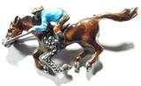 Jewelry Sterling Silver Enameled Horse Brooch
Darling vintage enameled sterling silver brooch shaped like a horse and jockey. Accented with Marcasite stones, marked "sterling". Total weight: .28 ozt.
