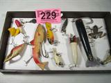 Mixed Lot Fishing Lures / Plugs / Tackle / Hooks
A great lot of vintage fishing lures. Fishing season is upon us and whether you are a collector or an avid angler these lures are spectacular. Lot includes:
- A rubber lure, made in France by VIVIF. Measures 6" long.
- A Heddon Sonar metal lure, measures 2.5" long.
- A rubber frog shaped lure.
- A wooden lure with a silver metal tail, measures almost 7" long.
- Several other wooden, metal, and plastic lures.
