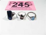 Jewelry Lot of 3 Sterling Silver Fashion Rings
Lovely sterling silver rings:
- Opal ring with 2 Cubic Zirconia stones, size: 8.25.
- Ring with teardrop shaped red colored stone, possibly a Garnet, size: 7.5.
- Ring with large rectangular shaped blue stone or glass accent, size: 6.
All pieces are marked sterling or 925. Total weight: .30 ozt.
