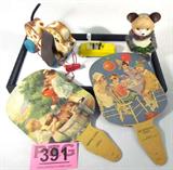Mixed Lot Vintage Toys / Fans Fisher Price & More
A wonderful lot filled with items that bring memories of yesteryear. Great lot for collectors! Includes:
- Fisher Price wooden pull puppy dog with blue wooden wheels and a red cotton string with a wooden shoe attached.
- "Keeping Cool" hand fan featuring two youngsters giving their dog a bath. Print is by artist Hintermeister.
- "His Birthday Party" hand fan featuring four children at a table with a birthday cake. Print is by artist Frances Tipton Hunter.
- A wind up tin and rubber bear made in Japan. The bear is holding a tin songbook. Appears to be in working condition although he does show signs of wear from age and use.
- A painted yellow cast metal car with rubber wheels. Appears to have been repainted. No manufacturer marks.