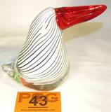 Magical Encased Design Art Glass Bird Figurine
A beautiful art glass / cyrstal bird figurine with encased black and white design in the body and a bright red beak. Measures 6.75" tall. There are no signatures nor manufacturer marks on the piece.