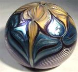 Orient & Flume Glass Paperweight Signed
A beautiful opalescent blue and brown art nouveau style glass paperweight. Signed on the bottom "Orient & Flume - 158 J 1976". Measures 2.25" tall and 9.5" in circumference.