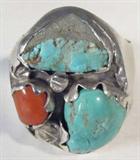 Jewelry Sterling Silver Turquoise & Coral Ring
Stately sterling silver men's ring with Southwestern style design. Featuring two turquoise nuggets and a piece of polished red coral. Unmarked, tests as silver. Ring size: 12.75, total weight: 1.03 ozt.