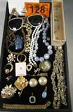 Jewelry Vintage Costume Pendants / Necklaces More
A great lot with beautiful vintage costume jewelry. Some items are:
- A stunning opalescent tear drop pendant, appears to be moonstone.
- A pretty basket of flowers brooch or pin. Signed "Kramer".
- A pair of vintage clip on sunglasses with pearl like frames.
- A Cloisonee style pendant shaped like a small jug.
- A Be-Ru Creation sweater guard featuring two butterfly shaped clips adorned with pretty rhinestones. Appears to be in its original box.
- A small flower shaped pin with a small opal stone in the center.
- Many more items.