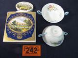 Mixed Lot Royal Cauldon Tea Caddy / Shelley Bowls
A nice mixed lot of decorative glassware includes:
- A Royal Cauldon Bristol Ironstone tea caddy made especially for R. Twinning & Co., Ltd. This jar is beautifully decorated with a scene of a skyline view of an an old city which is bordered in an elegant gold and royal blue. Appears to have the original glass lid. This jar has lots of crazing. Measures 6.75" tal.
- A pair of bone china double handled cream soup bowls made by Shelley of England. Bottom is stamped with the Shelley trademark as well as the pattern number, Wild Flowers 13668. Each bowl measures 2.25" tall.