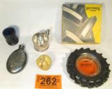 Mixed Lot Brunswick Ashtray / Cups / Owl / Flask
A mixed lot of nice decorative items which include:
- A Brunswick Tires advertising ashtray. Appears to be in the original box.
- A small silver color metal flash with etched designs on either side. Screw cap lid. Measures 5" long.
- A carved resin owl figurine. Measures 2" tall.
- A Bob St Clair commemorative bicentennial glass. Bottom is marked 1776 - 1976. Measures 2.5" tall.
- A silver color cup / mug with handle. Made by Watrous Mfg Co., Monogrammed. Measures 2.25" tall.