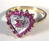 Jewelry 10kt Yellow Gold Heart Ruby Ring
Beautiful 10kt yellow gold ring with heart shaped design, accented with small round red colored stones, possibly rubies as well as 3 small diamond stones. Marked "10k", ring size: 6.5. Total weight: 1.2 dwt.