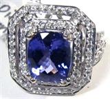 Jewelry 14kt White Gold Tanzanite & Diamond Ring
Fabulous 14kt white gold Tanzanite and Diamond ring. Size: 7.
Included AIG Pre-Sale Estimated Retail & Gemological report reads: "One electronically tested 14kt white gold ladies cast Tanzanite and diamond ring. Condition is new, good workmanship. The featured Tanzanite is set within a tiered diamond bezel, supported by diamond set, open filigree split shoulders and completed by a two and one half millimeter wide band. Bright polish finish Trademark is ORRIANE. Identified with markings of "14k". Containing:
One prong set rectangular cushion mixed cut natural Tanzanite, measuring 11.20 x 9.20 x 6.85mm, approximate weight of 5.74ct., clarity is eye clean, type 1, medium dark, moderately strong, bluish violet color, (GIA bV 6/4) to medium dark, moderately strong, bluish purple, (GIA bP 6/4), cut is good. Transmitting light with no distortion, transparent. The stone displays 40% extinction. Colored Stone Grading Report Attached. Graded in th