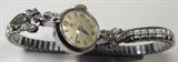 Jewelry 14kt White Gold Omega Watch
Beautiful 14kt white gold Omega ladies wrist watch with stainless steel Speidel twist flex style band. Marked "14kt Gold", accented with 4 small round diamond stones. Total weight: 8.8 dwt.