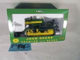 Farm Toy ERTL "John Deere 430 Crawler + Blade" MIB
Fantastic 1/16 scale die cast model / replica ERTL "John Deere 430 Crawler with Blade" tractor. Includes quality die-cast construction, rotating segmented tracks, detailed as engine, detailed blade, collector insert, and 1/64th gold plated crawler. Appears to be in its original box in mint condition. Previously displayed in a non smoking pet free home.