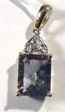 Jewelry 14kt Yellow Gold Mystic Topaz Pendant
Gorgeous 14kt yellow gold pendant featuring a large prong set mystic topaz stone and four small round diamond stones. Marked "14k", measures: 1" long. Total weight: 1.2 dwt.