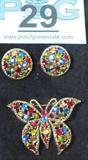 Jewelry Gorgeous Weiss Butterfly Brooch & Earrings
A gorgeous matching set of earrings and a butterfly shaped brooch, both signed Weiss. The round clip on earrings and are both gold color metal with shimmering multi-colored rhinestones