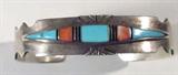 Jewelry Sterling Silver Coral & Turquoise Cuff
Stunning sterling silver cuff bracelet featuring inlaid polished red coral, turquoise and onyx stones in geometrical style design. Signed / marked "Wil sterling", measures: 5.75" wide with 1" opening. Total weight: .91 ozt.
ZB152
