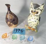 Mixed Lot Decorative Wood & Glass / Napkin Rings
This mixed lot includes:
- A set of four hand blown glass flower shaped napkin rings. Each is a different color; purple, blue, orange and green, and will add a nice touch to your place settings. Each is approximately 2" tall.
- A natural burl wood carved stem vase. Measures 7" tall. Signed "E. Cole '82".
- An owl shaped porcelain vase which appears to be hand painted. Bottom is marked "Italy". Measures 8" tall.
