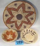 Lot of 3 Southwestern Style Hand Woven Baskets
Vintage Native American southwestern style woven baskets. Each basket appears to be authentic and skillfully hand woven. Lot includes:
- A small orange sunburst pattern basket. Measures 7.75" in diameter.
- A small basket with brown decorations. Measures 8.5" wide.
- A large basket with an orange and brown star pattern. Measures 16" in diameter.