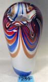 Large Hand Blown Glass Art Vase
A very large hand blown glass vase featuring a brown and blue swirl design. Vase has some natural air pockets in the glass and a small stress crack deep inside the top opening which is not visible from the outside. Signed "Jason '71". Measures approximately 16" tall.