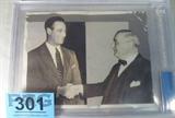 Gehrig & Ruppert Photo Beckett Authenticated
An authentic 1938 type 1 news service photograph featuring Lou Gehrig and Colonel Jake Ruppert. Presented in an acrylic frame, this photograph is certified "Authentic" by Beckett Grading Services, serial number 0006951222.
From the internet: "
"Henry Louis "Lou" Gehrig (June 19, 1903 – June 2, 1941), nicknamed "The Iron Horse" for his durability, was an American Major League Baseball first baseman. He played his entire 17-year baseball career for the New York Yankees (1923–1939). Gehrig set several major league records. He holds the record for most career grand slams (23). Gehrig is chiefly remembered for his prowess as a hitter, his consecutive games-played record and its subsequent longevity, and the pathos of his farewell from baseball at age 36, when he was stricken with amyotrophic lateral sclerosis. Gehrig was elected to the Baseball Hall of Fame in 1939. In 1969 he was voted the greatest first baseman of all time by the Baseball Write