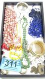 Jewelry Vintage Costume Beads Earrings & More
This lot contains beautiful vintage jewelry which includes:
- A gold color Veterans of Foreign War (VFW) lapel pin with a clear plastic ribbon which reads 1944.
- A necklace with graduated size yellow beads and a pair of matching screw back earrings.
- A triple strand necklace with pink and mauve colored beads.
- A gorgeous multi strand necklace of blue beads which appear to be glass.
- A gold color mesh cuff bracelet in the shape of a snake.
- Many more vintage pieces.