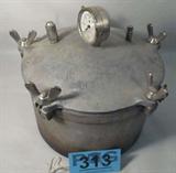 Kook Kwick Steam Pressure Cooker #6
A vintage steam pressure cooker embossed "Kook Kwick 6". Steam valves are in place. Pressure gauge is in place but the glass is broken. Wood and wire handle appears to be original. Great decorator piece.