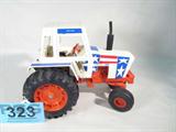Farm Toy CASE "Spirit of '76" Patriotic Tractor
Awesome authentically scaled die cast model / replica CASE "Spirit of '76" Patriotic themed tractor, with an enclosed cab, exhaust stack & rear hitch. Rubber front & rear tires, red white & blue stars & stripes. In great condition, a little dusty. Previously displayed in a non smoking pet free home.