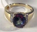 Jewelry 14kt Yellow Gold Mystic Topaz Ring
Gorgeous 14kt yellow gold ring featuring a prong set oval shaped mystic topaz stone and eight small round diamond stones. Marked "14k", ring size: 7.25. Total weight: 2.5 dwt.
