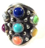 Jewelry Sterling Silver Multicolored Stone Ring
Fabulous sterling silver ring featuring several multicolored stones in sawtooth setting. Some stones included are turquoise, lapis lazuli and Mother of Pearl. Signed / marked "WP sterling", ring size: 12.25. Total weight: .40 ozt.
ZB152