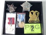 Mixed Lot Police & Military Ribbons / Badges
Lot contains:
- A Chicago Police Sergeant, Precinct 1460, emblem. Made by G.H. Hanson Co., Chicago, IL.
- A Chicago Police Retired Patrolman's badge.
- A gold color "Sergeant" badge for an unidentified agency.
- A Korean Service military ribbon and medal.
- A United States Marine Corp military ribbon and medal.