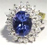 Jewelry 14KT White Gold Tanzanite Diamond Ring AIG
Stunning 14KT white gold, Tanzanite & diamond ring. Included AIG Pre-Sale Estimated Retail & Gemological Report reads: 
"One electronically tested 14K white gold ladies cast Tanzanite and diamond ring with a bright polish finish. Condition is new, good workmanship. The featured diamond [Tanzanite] is set within a two tiered diamond lattice gallery, supported by split shoulders and completed by a two millimeter wide band. Identified with markings of "14K". Containing:
One prong set oval mixed cut natural Tanzanite, measuring 10.10 x 7.50 x 5.45 mm, approximate weight of 2.73ct, clarity is eye clean, type I, medium, very slightly grayish blue color GIA B 5/3) to medium, very slightly grayish, purple, (GIA P 5/3) cut is good. Transmitting light with no distortion, transparent. The stone displays 40% extinction. Graded in setting. Tanzanite is a very rare gemstone that is found only in the country of Tanzania. Originally discovered in 1967