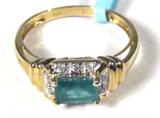 Jewelry 10kt Yellow Gold Emerald & Diamond Ring
Elegant 10kt yellow gold ring featuring a prong set emerald stone surrounded by 6 small round diamond stones. Marked: "10k" ring size: 7. Total weight: 1.2 dwt.