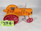 Farm Toy "Minneapolis Moline VTS" w/ Placque
Awesome authentically scaled die cast model / replica "Minneapolis Moline VTS" tractor, unknown manufacturer, with silver exhaust stack, wide set wheels (wide crop style), rear hitch, & red sandcast steel wheels. Placque on the back fender reads: "1991 26th Tri-State Gas Engine & Tractor Show, Portland, Ind. Serial No. 287." In good condition, some places on the steering wheel & rear tires where paint is chipped. Previously displayed in a non smoking pet free home.
