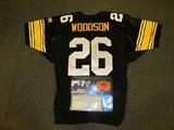 Rod Woodson Autographed Football Jersey COA
A Wilson brand football jersey which has been hand signed by Rod Woodson. The black jersey has the name "Woodson" sewn across the top back in gold lettering and the number "26" across the front in white lettering. Accompanied by an original snapshot of Woodson signing the jersey and a notarized Certificate of Authenticity. Certificate reads, "This document certifies that Rod Woodson has personally autographed the item that accompanies this document under my direct supervision. The autograph signing took place in my store on October 27, 1998. The signature is unconditionally guaranteed as to it's authenticity by Great Moments." Signed John Conigliaro, President, Great Moments - Westminster, Maryland.
From the internet: "Roderick Kevin "Rod" Woodson (born March 10, 1965) is a former American football defensive back who played in the National Football League for seventeen seasons. He had a 10-year stint with the Pittsburgh Steelers and was a key