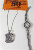 Jewelry 2PC Set Sterling Silver Necklace & Watch
Gorgeous 2 piece jewelry set including:
- Beautiful sterling silver necklace featuring a sparkling pendant, several small chrome colored stones, possibly Marcasite, in a monogram of a "D". Pendant marked / signed "A925". Hangs upon a box style chain marked / signed "925". Measures 23.75" long.
- Gorgeous sterling silver lady's watch, Quartz, marked / signed "Japan Quartz Movt. Stainless Steel Back 925". Features several chrome colored stones, possibly Marcasite, positioned all around the face of the watch and along the band. Measures 6.5" long.
Total weight: 1.03 ozt
ZB2447-9081-CFSG52300