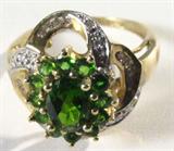 Jewelry 10kt Yellow Gold Peridot & Diamond Ring
Elegant 10kt yellow gold cocktail ring featuring prong set green colored stones, possibly Peridot, as well as several small round diamond stones. Marked "10k", ring size: 8.25. Total weight: 2.6 dwt.
ZB1341