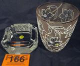 Lot of 2 Crystal Ashtray & Flower Vase
Lot contains:
- A beautiful lead crystal ashtray embellished with the 12 signs of the Zodiac. No manufacturer marks or dates. Measures 2" tall x 5.5" in diameter.
- A gorgeous satin finish crystal vase with painted flower pattern on entire outer surface. No manufacturer marks or dates. Measures 6" tall x 5" in diameter.
ZB152