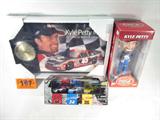 NASCAR Lot of 3 Kyle Petty Memorabilia & More
Awesome lot of NASCAR memorabilia, all appear to be in their boxes in new / mint condition:
- Kyle Petty bobble head, #45 race car driver, holding a Coca Cola, wearing a GP Georgia - Pacific racing uniform. In original box, "The Coca Cola Racing Family". Measures 9.5" tall.
- Awesome Kyle Petty #45 commemorative plaque wall clock. Appears to be in original packing, plastic wrap is unbroken. Measures 16" x 10.75".
- Three 1:64 scale stock cars, # 66, 34, and 36, sponsors: Philips, Goulds Pumps, and Stanley, limited edition set, 1 of 5,999. Made by Cicci Welliver Racing / Racing Champions.
ZB4273