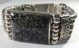 Jewelry Sterling Silver & Agate Fashion Bracelet
Wonderful sterling silver bracelet featuring a large rectangular multi colored / speckled stone, possibly agate, in a silver bezel setting. 4 thick snake style chains banded together with ornate sterling silver embossed pieces. Marked / signed "925". Terminates with a box tab insert clasp with a back up safety chain, measures 8" long (est).
Total weight: 2.5 oz
#2447-9201-CFSG52300