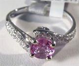 Jewelry 18kt White Gold Sapphire & Diamond Ring
Beautiful 18kt white gold pink Sapphire and Diamond ring. Size: 7.25.
Included GLA Premium Appraisal reads:
"One lady's polished, stamped and electronically tested solid 18k white gold ring mounted with: 1 Genuine Pink Sapphire (Corundum) and 67 round single diamonds. This item weighs 2.90 grams and fits a finger size 7.25. The setting measures 7.85 x 5.72 mm and the band measures 2.72 mm tapering down to 2.10mm at the center of the shank. The condition is BRAND NEW. The gemstones have been analyzed in the mounting.
Identity: Genuine Pink Sapphire (Corundum)
Shape: Round (faceted)
Measurements: 5.56 x 2.50 mm (est.)
Quantity: 1
Carat Weight: 0.83 ct (est.)
Clarity Type: II=may include eye-visible features
Hue: pink
Transparency: Transparent
Tone: Light
Saturation: Vivid - Bright
Polish: 8-Very Good-Excellent
Finish: 6-Good-Very Good
Quality: 7-Very Good
Adjacent Gemstone:
Identity: Diamond
Cut: Round Single (faceted)
Measurements: 0.90-0