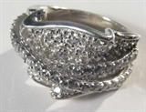 Jewelry Sterling Silver CZ Fashion Ring
Gorgeous sterling silver fashion ring featuring several round sparkly Cubic Zirconia stones in ribbon style designs. Marked "FADI 925 China", ring size: 8.25. Total weight: .44 ozt.
ZB1341