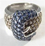 Jewelry Sterling Silver Buckle Gemstone Ring
Lovely sterling silver fashion ring with belt buckle design featuring several prong set blue and pink gemstones. Marked "925", ring size: 7.75. Total weight: .32 ozt.
ZB1341
