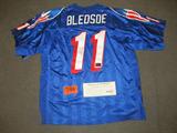Drew Bledsoe Autographed Football Jersey COA
A New England Patriots football jersey which has been hand signed by Drew Bledsoe. The Starter brand jersey is blue with red and white lettering, the number "11" across the front and the name "Bledsoe" across the top back. Accompanied by a Certificate of Authenticity which reads, "The above listed item is unconditionally guaranteed to be an authentic signed piece of sports memorabilia. Witnessed and Verified by: Gustavo Rojas, VP Finance and Operations, Subtle Perfection, LLC and Jon Carmichael, VP Sales an Marketing, Subtle Perfection, LLC."
From the internet: "Drew McQueen Bledsoe (born February 14, 1972)[2] is a former American football quarterback in the National Football League, best known as the starting quarterback for the New England Patriots from 1993-2001. During the 1990s, he was considered the face of the Patriots franchise. Bledsoe, a Pro Bowler, All-American for the Washington State Cougars and #1 overall draft pick in the 1993