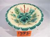 Majolica Sarreguemines Leaf Vine & Grape Bowl
An antique French Sarreguemines Majolica bowl with a leaf, vine, and grape pattern with a beautiful scalloped rim. There are a few small chips in the inside of the bowl, and some hairline cracks near the rim, and lots of crazing on this piece due to age. Measures 3" tall with a 12.25" diameter.
Z14