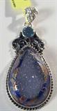 Jewelry Sterling Silver Painted Druzy Pendant
Stunning unique sterling silver oval shaped pendant featuring a large sparkly Druzy pendant with hand painted designs around edge. Also accented with a aqua colored faceted gemstone. Marked "925 STS", measures: 2" long. Total weight: .39 ozt.
ZB1341