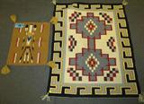 Lot of 2 Native American Handwoven Rug & Placemat
This lot contains the following items which appear to be hand woven wool:
- A place mat or small table cloth with a light brown background and a Yei pattern down the center. Measures 19" x 15".
- A beautiful rug with geometric patterns featuring a black and yellow border with red, brown, and grey designs in the center. Measures 40" x 32".
Z14